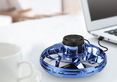 Homeshinex interactive decompression toy for kids in blue placed on a table near a laptop