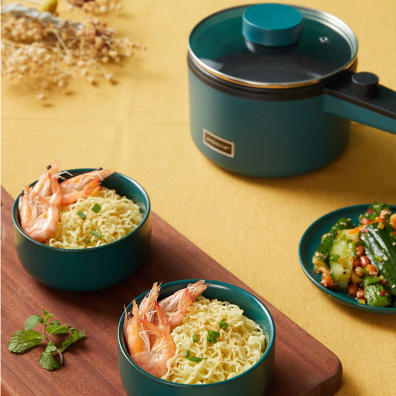 Homeshinex mini electric cooking pot in teal with cooked noodles and shrimp served in matching bowls
