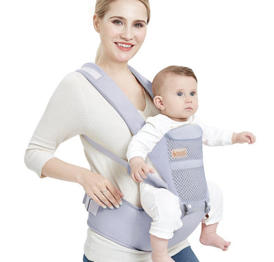 Homeshinex ergonomic child sitting carrier bag in light gray with a baby comfortably seated and a smiling woman wearing it