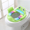 Homeshinex green children potty training seat with handles featuring a colorful cushioned design and frog face