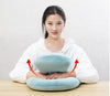 Homeshinex baby travel neck pillow with arm rest in light blue held by woman wearing white shirt