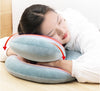 Homeshinex travel neck pillow with arm rest in soft blue used by woman resting head and arms comfortably