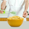 Homeshinex versatile kitchen spoon for pasta and eggs in use with yellow bowl of spaghetti